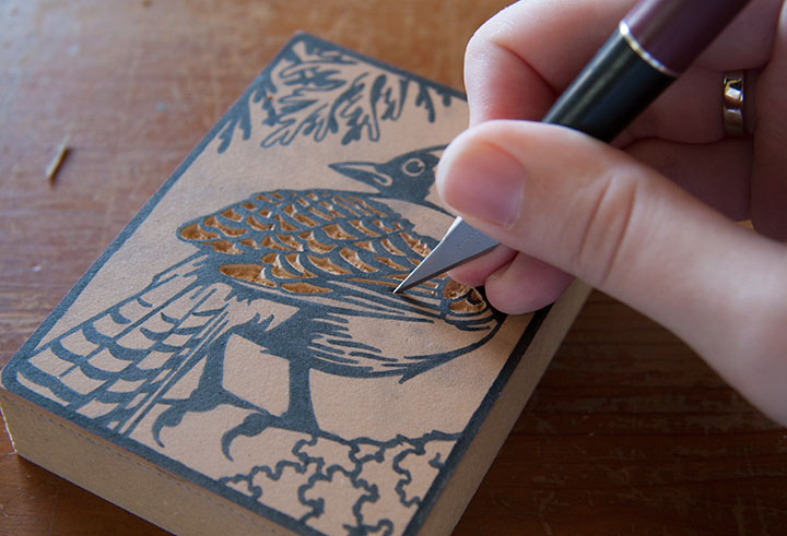 Process photo of "Flock" linocut bird prints by Chandler O'Leary
