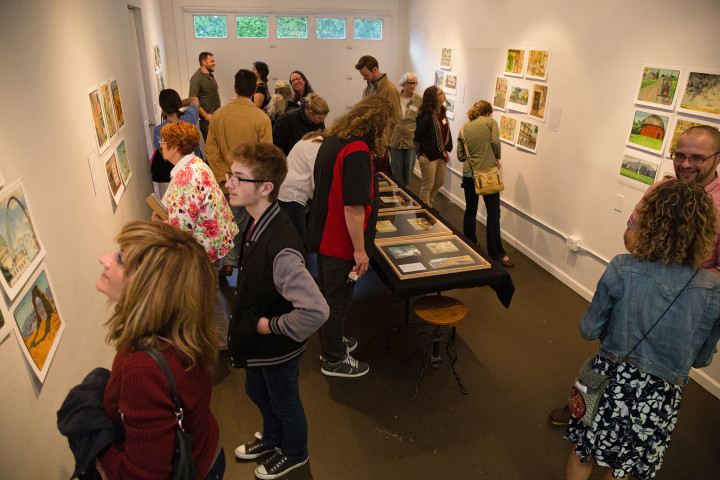 "Jaunt + Jot" exhibition featuring sketchbook drawings by Chandler O'Leary. Photo by Shawn H. Nichols, taken at the Artist Trust on Tour: Tacoma event.