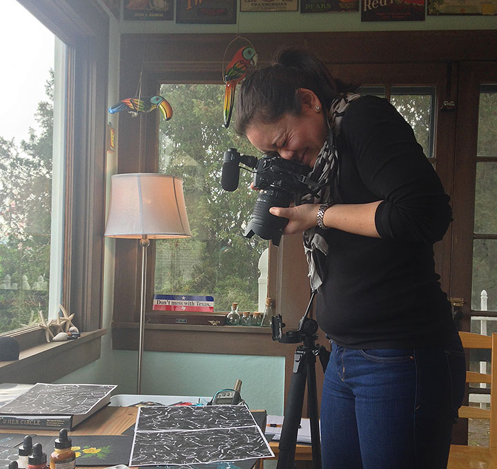 Emilie Firn photographing artwork in Chandler O'Leary's studio