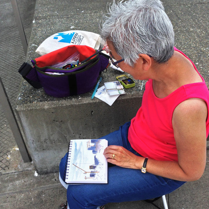 Student sketching in Seattle during urban sketching workshop with Chandler O'Leary