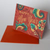 Happy New Year rosemaling holiday card illustrated and hand-lettered by Chandler O'Leary